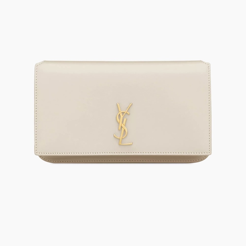 Yves Saint Laurent Cream phone holder.